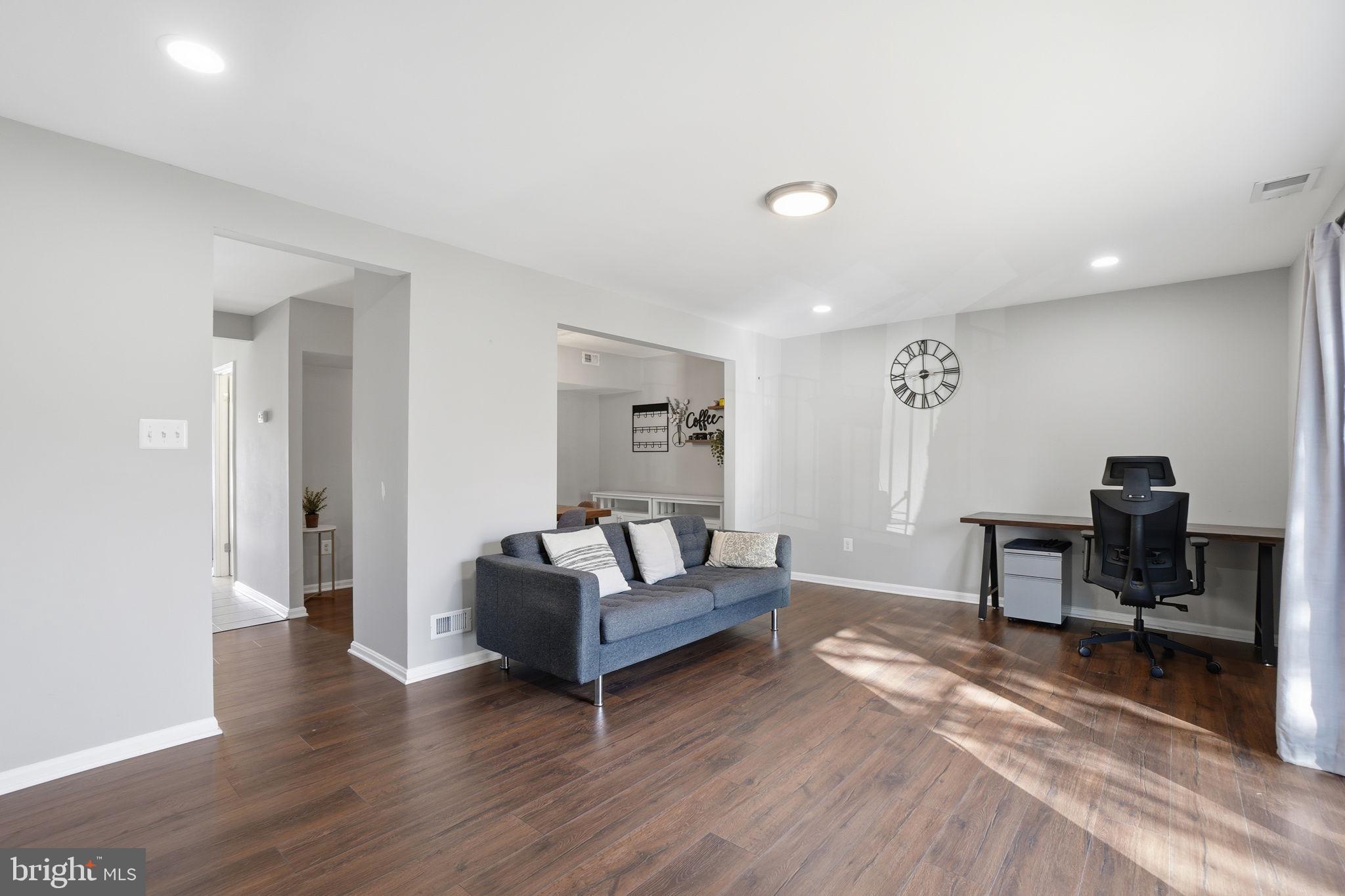 9175 Broken Oak Place, Unit 39B Burke, VA 22015 - Photo 6 of 35 a living room with furniture and a wooden floor