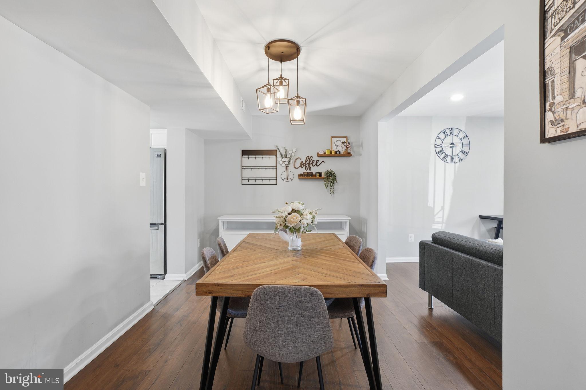 9175 Broken Oak Place, Unit 39B Burke, VA 22015 - Photo 8 of 35 a view of a dining room with furniture and wooden floor