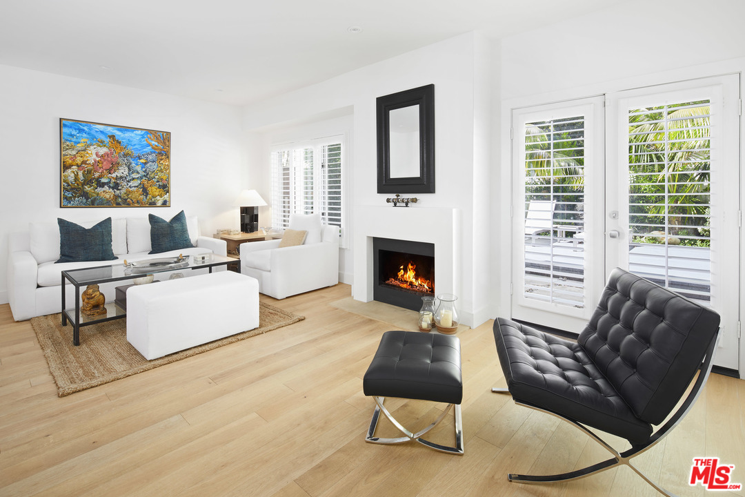 52 Olive Road Santa Barbara, CA 93108 - Photo 6 of 13 a living room with furniture fireplace and a large window