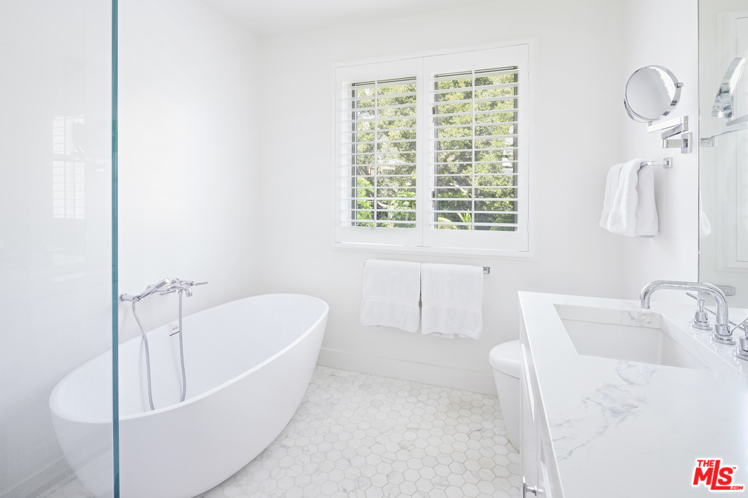 52 Olive Road Santa Barbara, CA 93108 - Photo 10 of 13 a white bath tub sitting next to a white sink