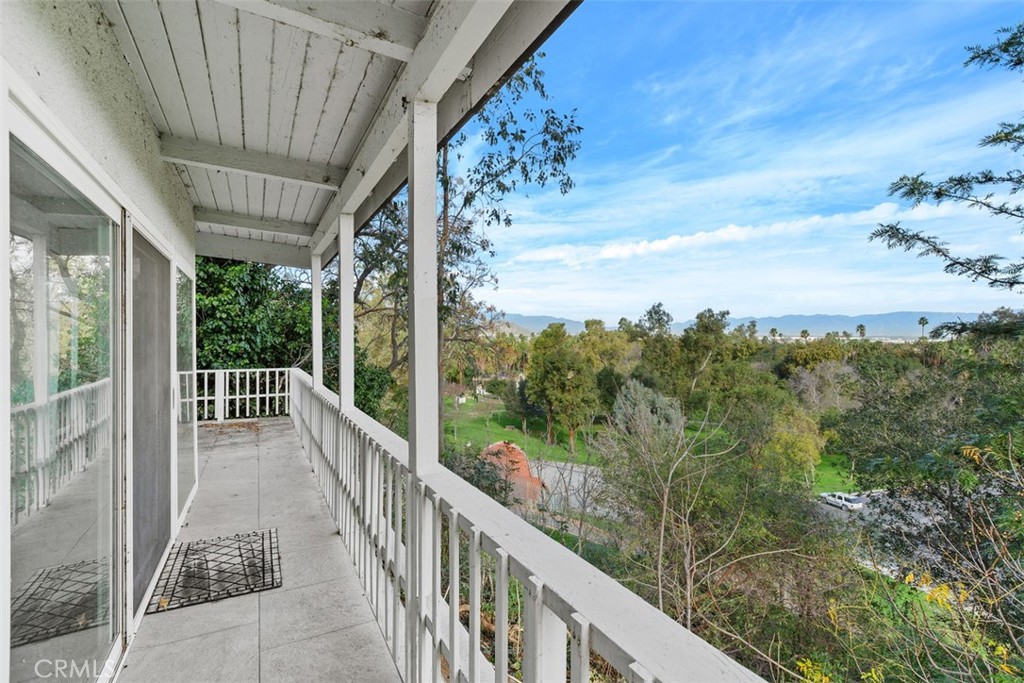 a view of a balcony with an outdoor space