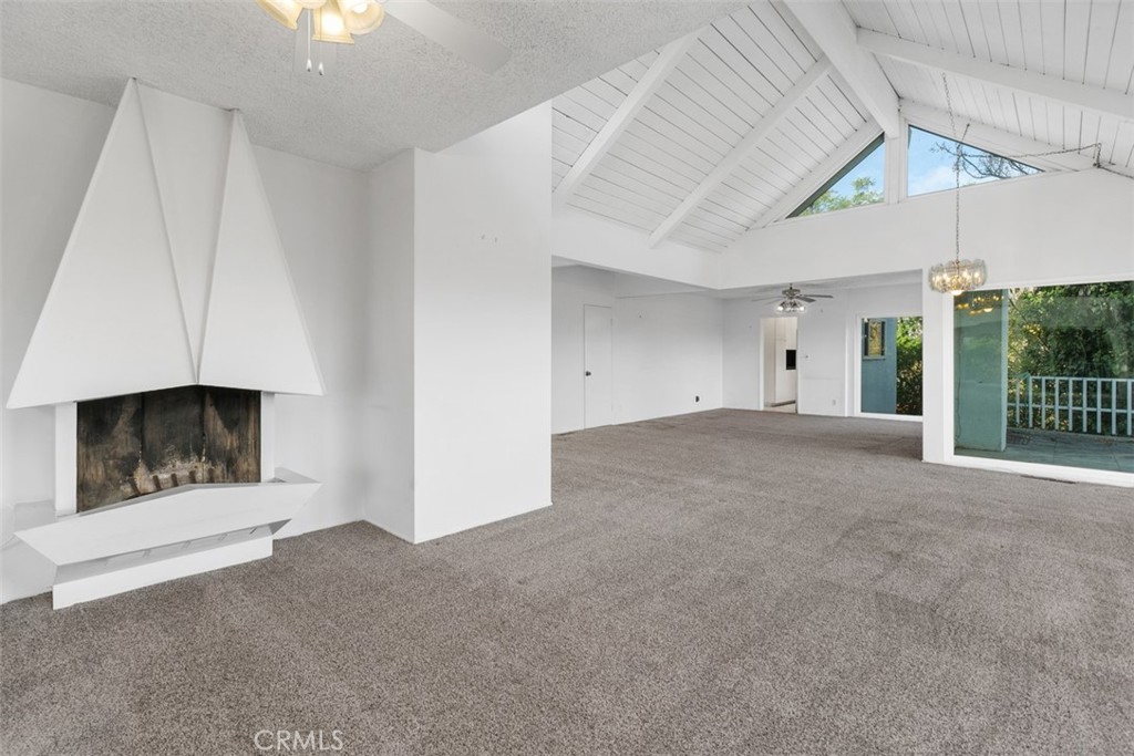 4121 Park View Terrace Riverside, CA 92501 - Photo 16 of 41 a view of an empty room with a fireplace and a window