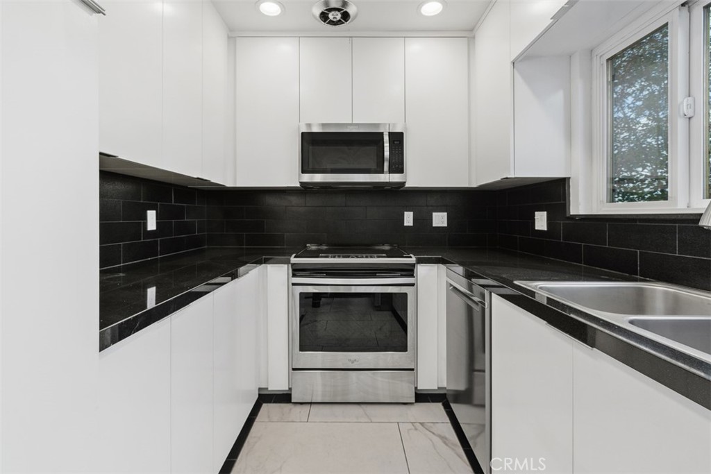 4121 Park View Terrace Riverside, CA 92501 - Photo 19 of 41 a kitchen with a sink and a microwave