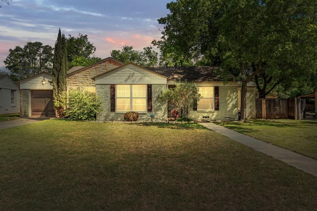 3566 Norfolk Road Fort Worth, TX 76109 - Photo 1 of 1 a front view of a house with a yard and garage