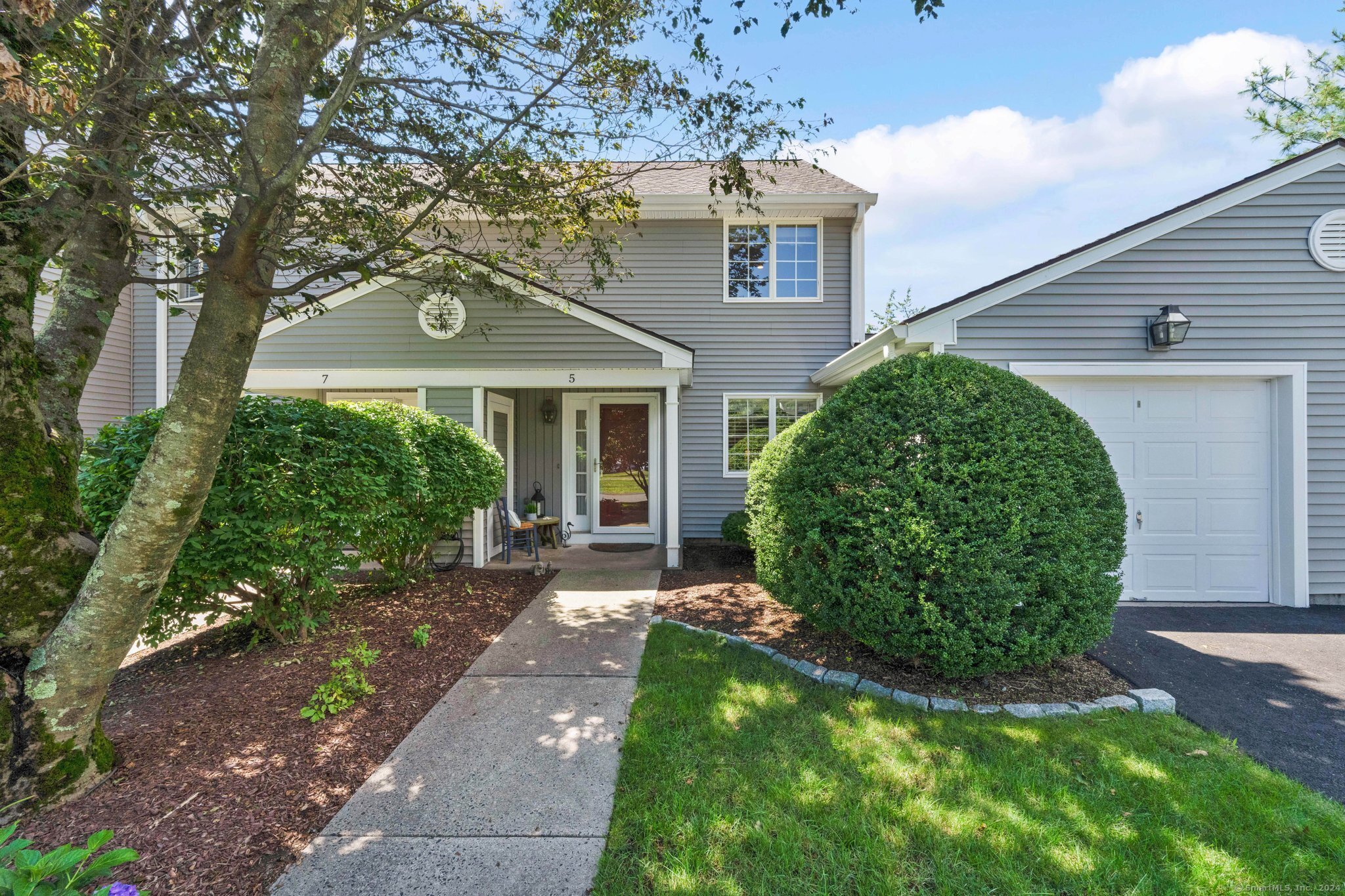 5 Copley Road, Unit 5 Glastonbury, CT 06073 - Photo 1 of 1 front view of a house with a yard