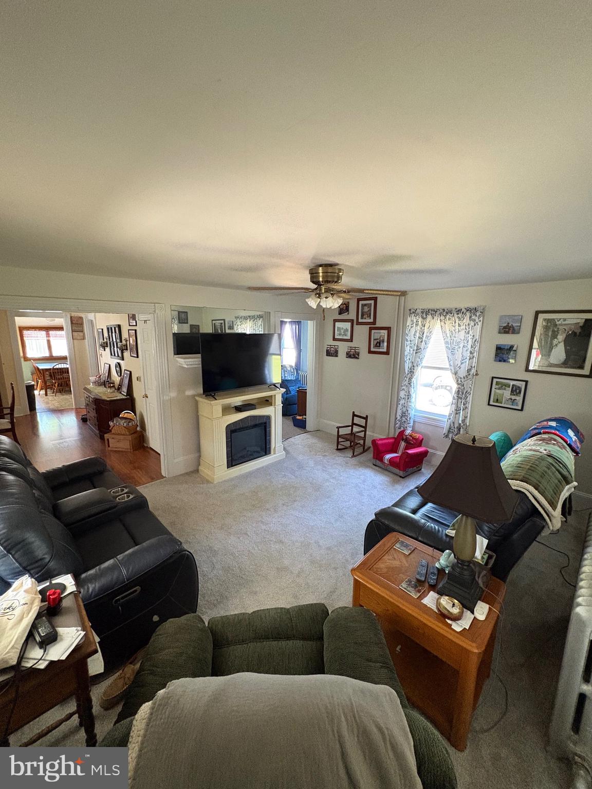 909 Main Street Salem, NJ 08079 - Photo 17 of 35 a living room with furniture a flat screen tv and a window
