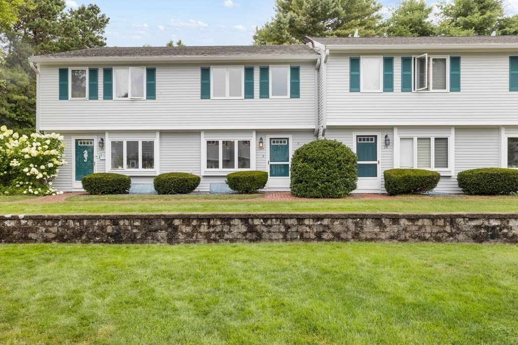 174 Lowell Road, Unit 135 Mashpee, MA 02649 - Photo 1 of 21 a view of a house with a yard