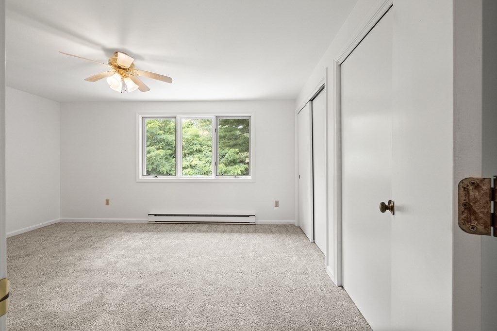 174 Lowell Road, Unit 135 Mashpee, MA 02649 - Photo 12 of 21 a view of an empty room with a window