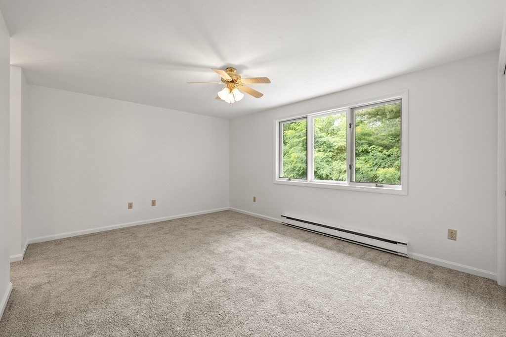 174 Lowell Road, Unit 135 Mashpee, MA 02649 - Photo 13 of 21 an empty room with a window