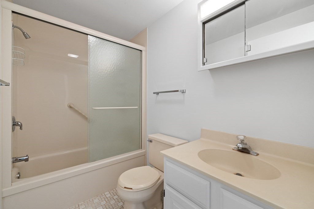 174 Lowell Road, Unit 135 Mashpee, MA 02649 - Photo 16 of 21 a bathroom with a sink toilet and shower