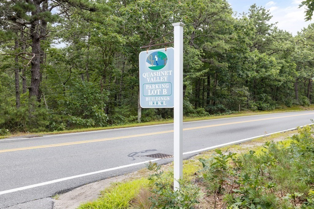174 Lowell Road, Unit 135 Mashpee, MA 02649 - Photo 21 of 21 a view of a street sign