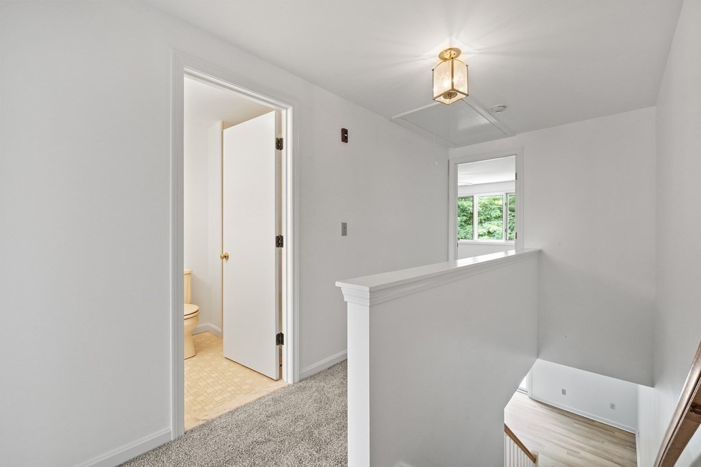 174 Lowell Road, Unit 135 Mashpee, MA 02649 - Photo 8 of 21 a view of an entryway with wooden floor