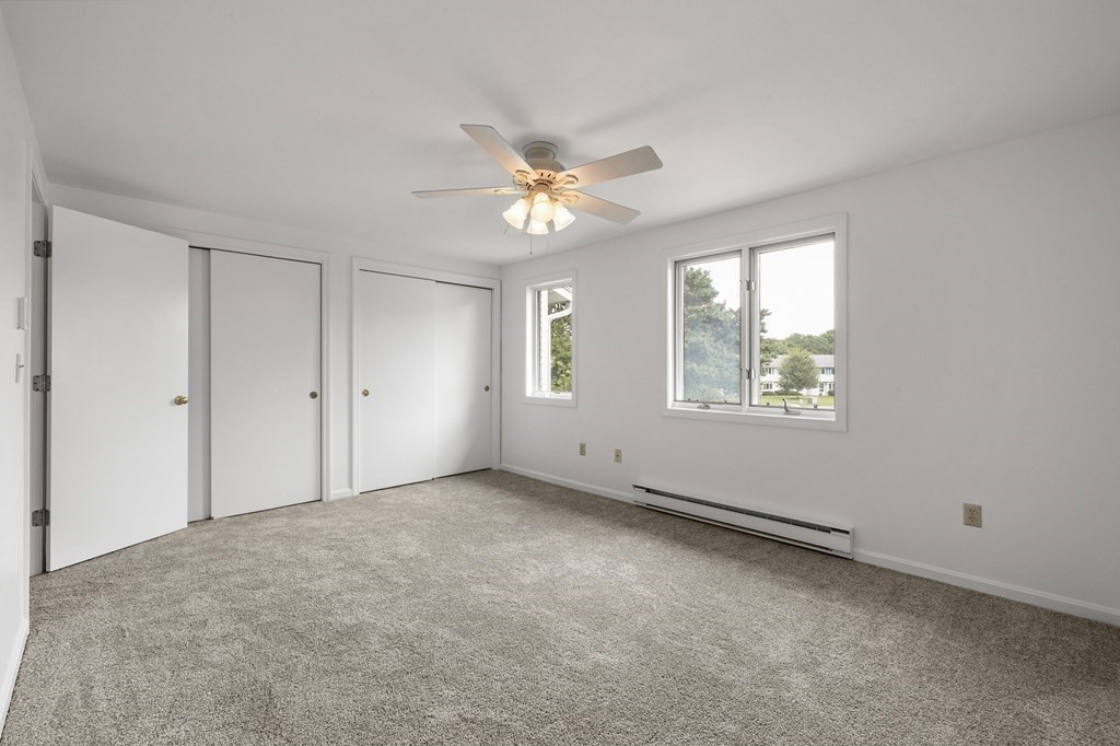 174 Lowell Road, Unit 135 Mashpee, MA 02649 - Photo 10 of 21 a view of an empty room with a window