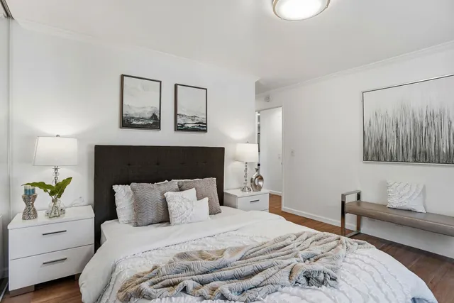 a bedroom with a bed and a couch