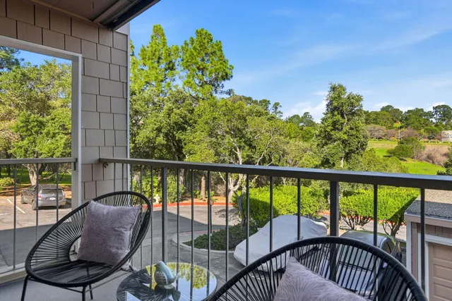 a view of a chair and table in the balcony