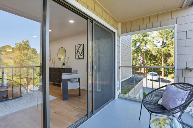 a view of a livingroom with furniture and front door