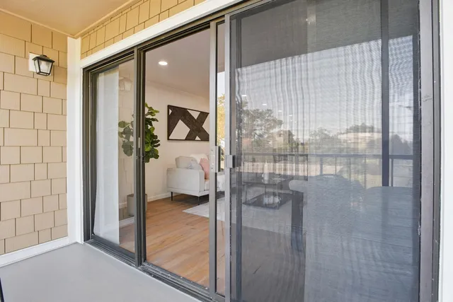 a bathroom with a glass shower door