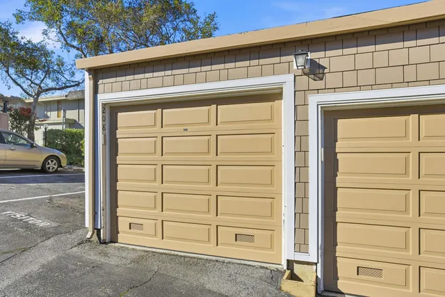 a front view of a house with a garage