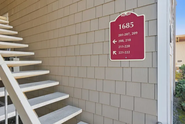 a sign board with a red gate