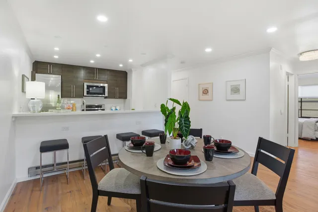 a kitchen with a table and chairs in it