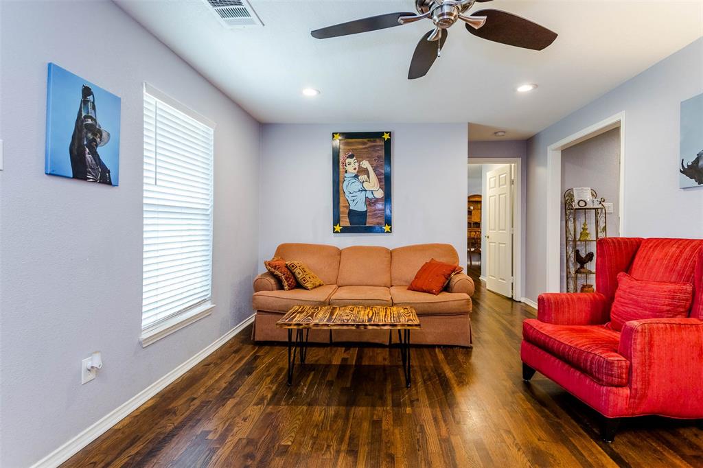 1333 South Pine Street Grapevine, TX 76051 - Photo 13 of 33 a bedroom with furniture and a wooden floor