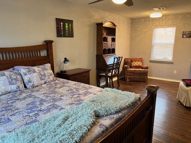 1333 South Pine Street Grapevine, TX 76051 - Photo 18 of 33 a bedroom with a bed and wooden floor