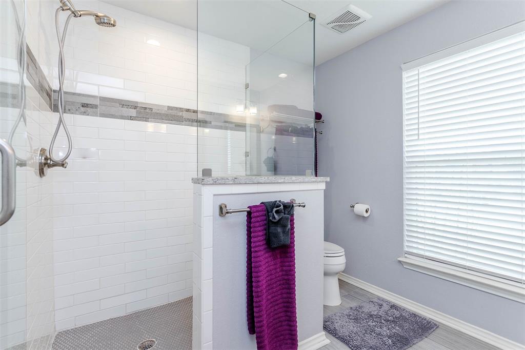 1333 South Pine Street Grapevine, TX 76051 - Photo 23 of 33 a bathroom with a toilet sink and shower