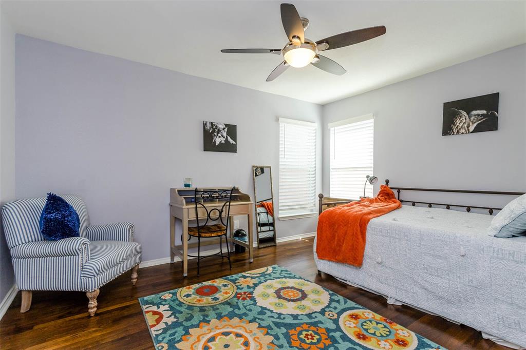 1333 South Pine Street Grapevine, TX 76051 - Photo 27 of 33 a bedroom with bed and a workspace
