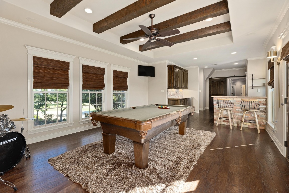 216 Vista Lane Georgetown, TX 78633 - Photo 27 of 40 a living room with furniture a rug and a flat screen tv