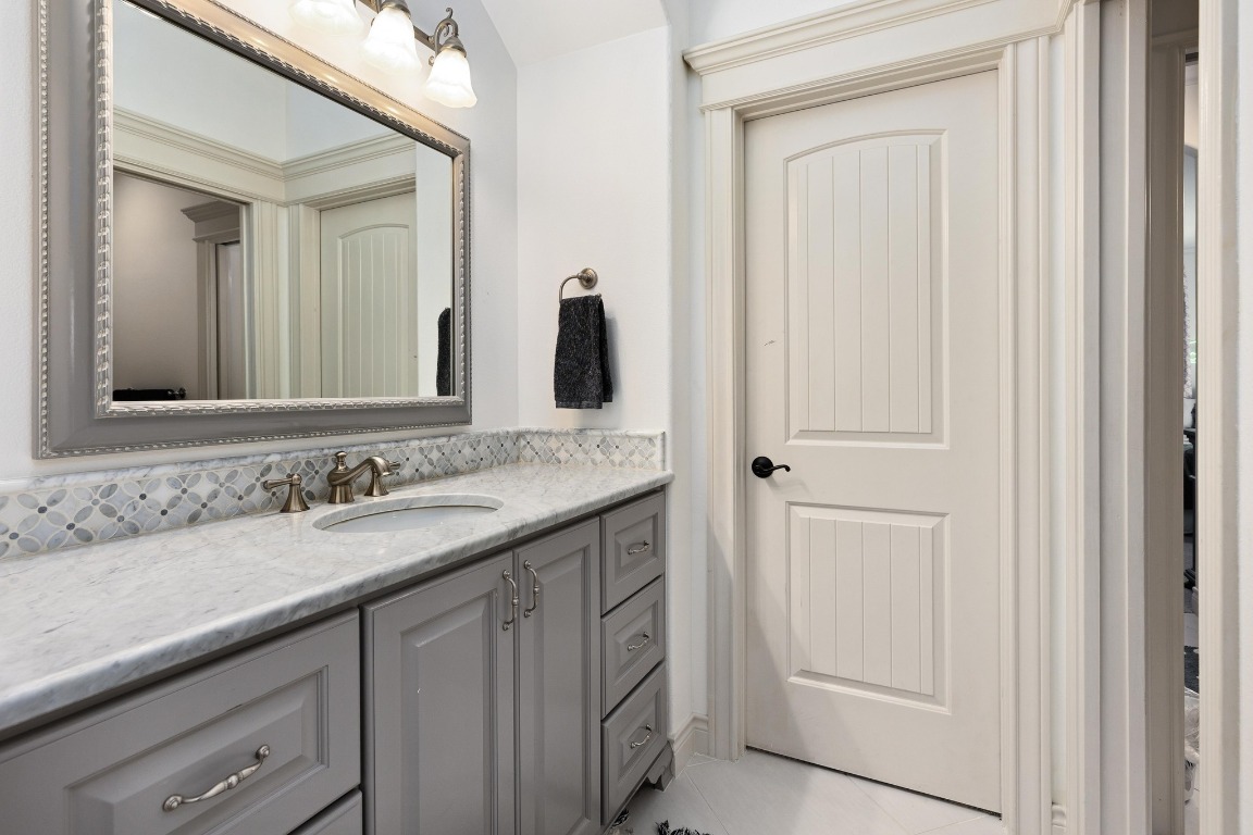 216 Vista Lane Georgetown, TX 78633 - Photo 34 of 40 a bathroom with a sink and a mirror