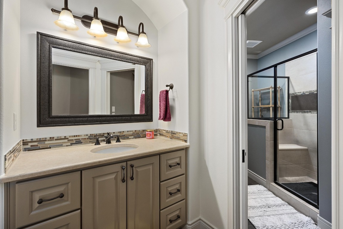 216 Vista Lane Georgetown, TX 78633 - Photo 35 of 40 a bathroom with a sink vanity and a mirror