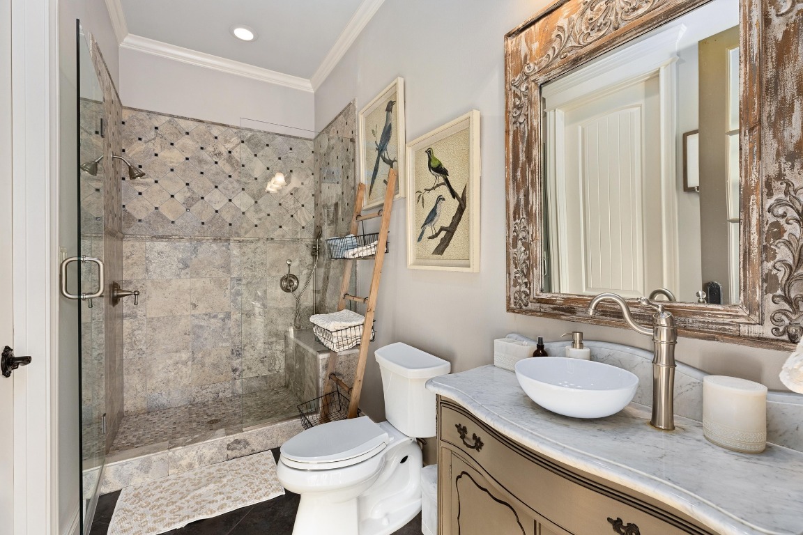 216 Vista Lane Georgetown, TX 78633 - Photo 36 of 40 a bathroom with a granite countertop sink toilet a mirror and shower