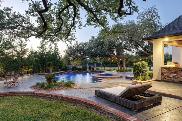 a view of a patio with swimming pool
