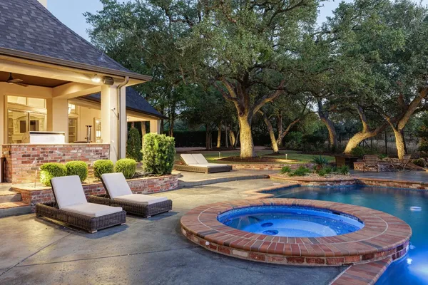 a view of backyard with outdoor seating and green space