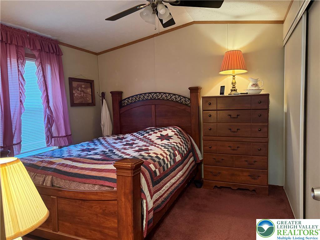 15 Chestnut Ridge Circle Kunkletown, PA 18058 - Photo 23 of 31 a bedroom with a bed and a mirror