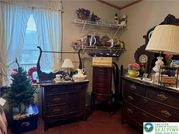 a view of room with cabinets and flat screen tv