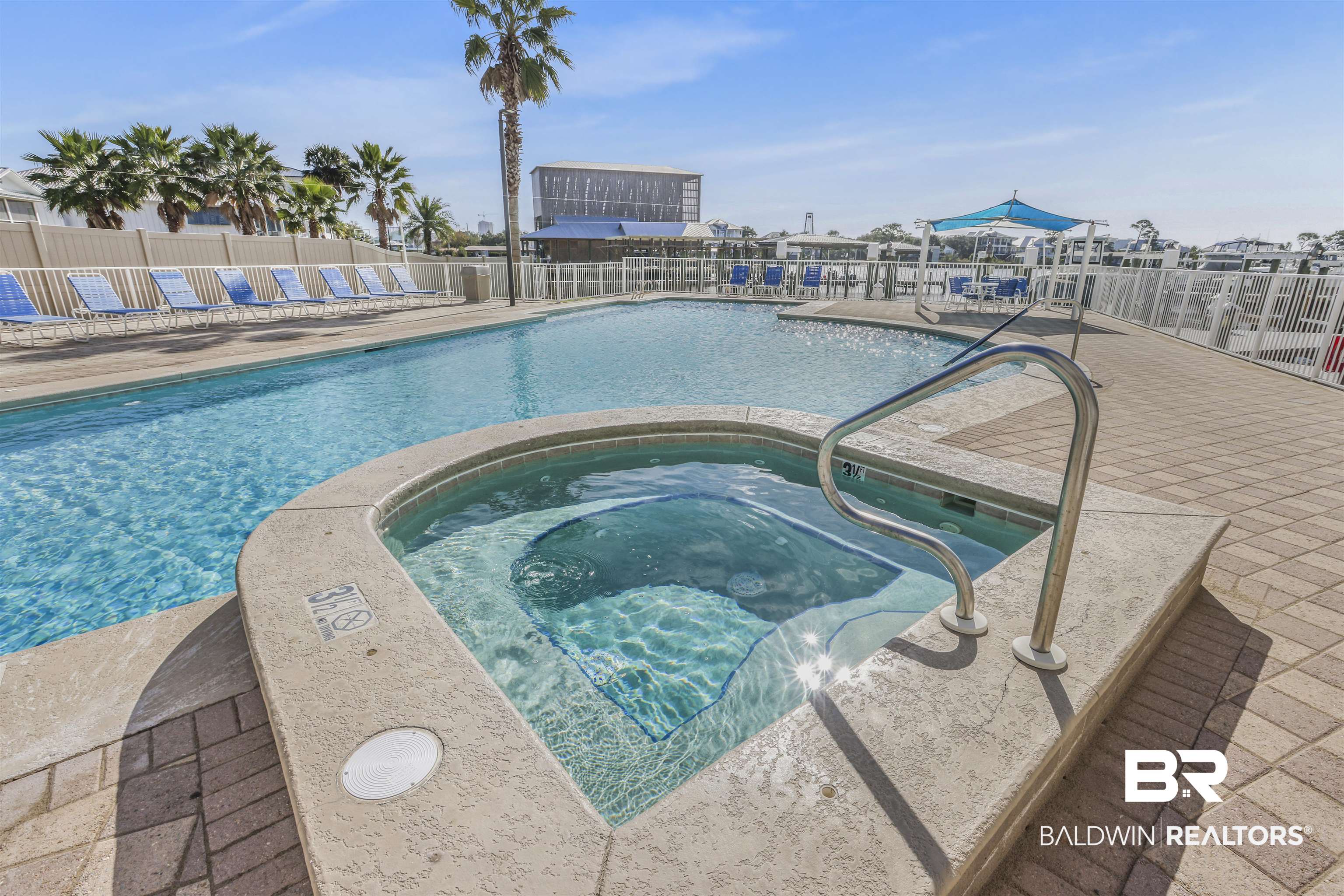 28250 Canal Road, Unit 106 Orange Beach, AL 36561 - Photo 34 of 50 Community pool featuring a community hot tub and a patio area