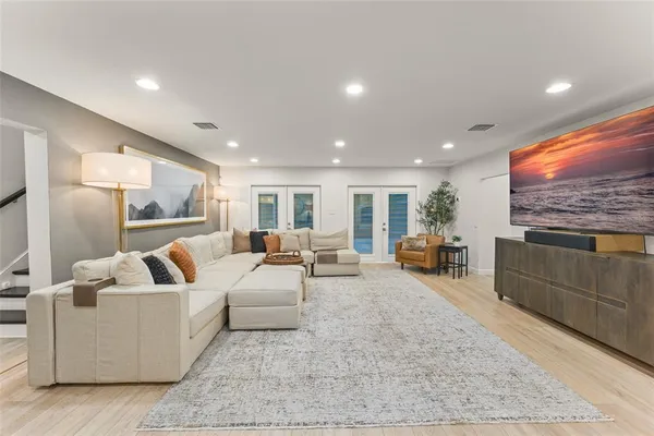 a spacious bathroom with a double vanity sink toilet and shower