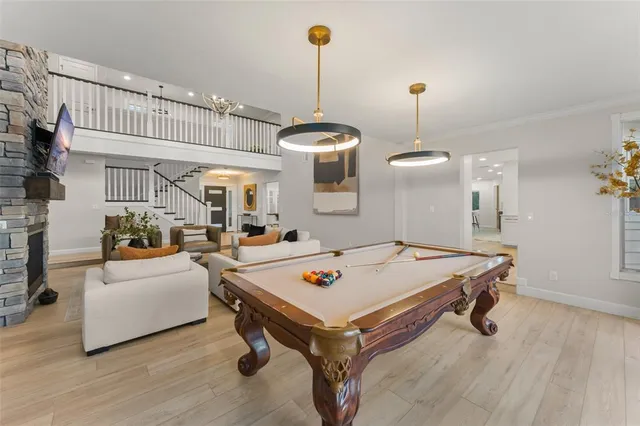 a spacious bathroom with a double vanity sink a mirror and shower