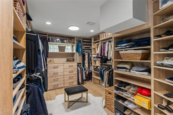 a kitchen with a stove a refrigerator and a fireplace