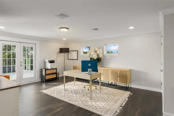 a bedroom with a bed and a ceiling fan