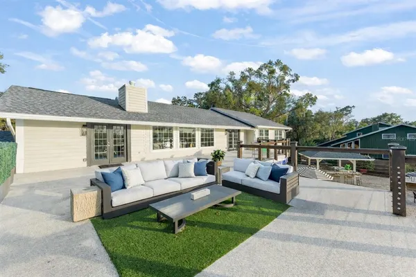 a open kitchen with stainless steel appliances granite countertop a sink and stove top oven