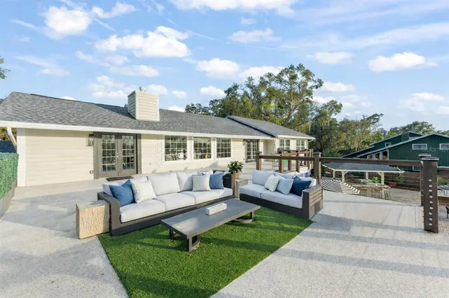 a open kitchen with stainless steel appliances granite countertop a sink and stove top oven