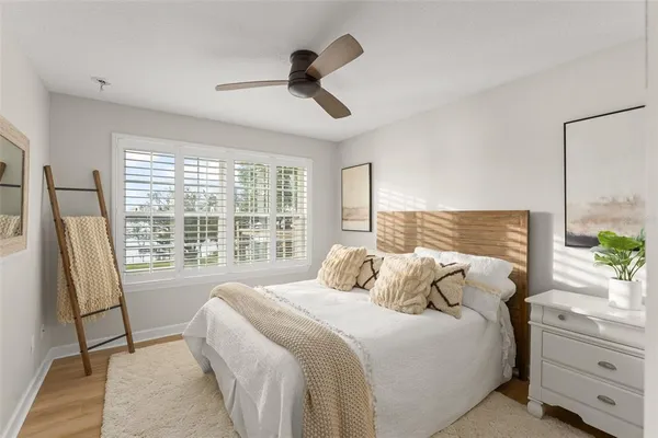 a aerial view of a house with a yard and lake view