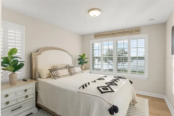 a view of a lake with a table under an umbrella