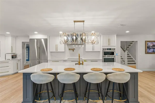 a kitchen with a sink and cabinets