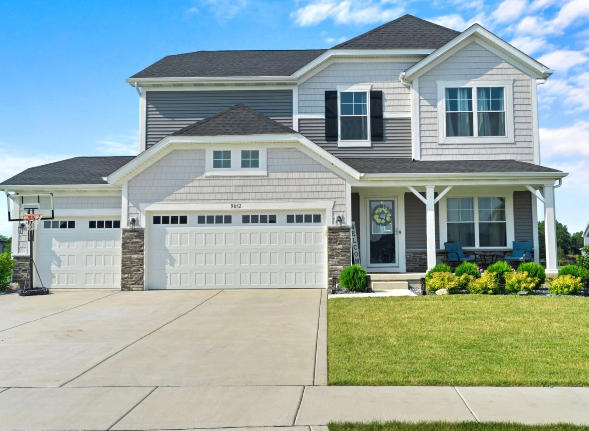 9872 Sumter Court Cedar Lake, IN 46303 - Photo 1 of 18 a front view of a house with garden