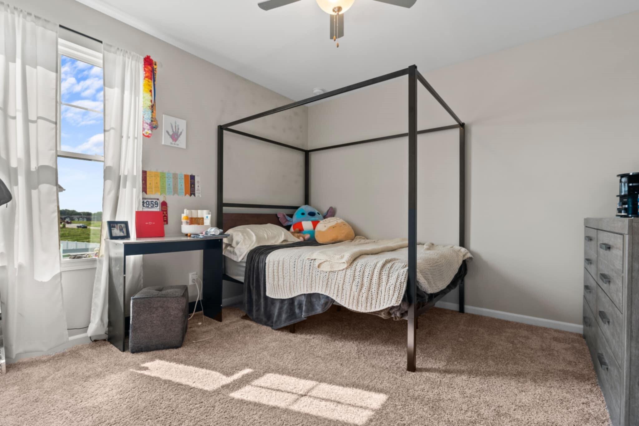 9872 Sumter Court Cedar Lake, IN 46303 - Photo 15 of 18 a bedroom with a bed a chandelier and a window