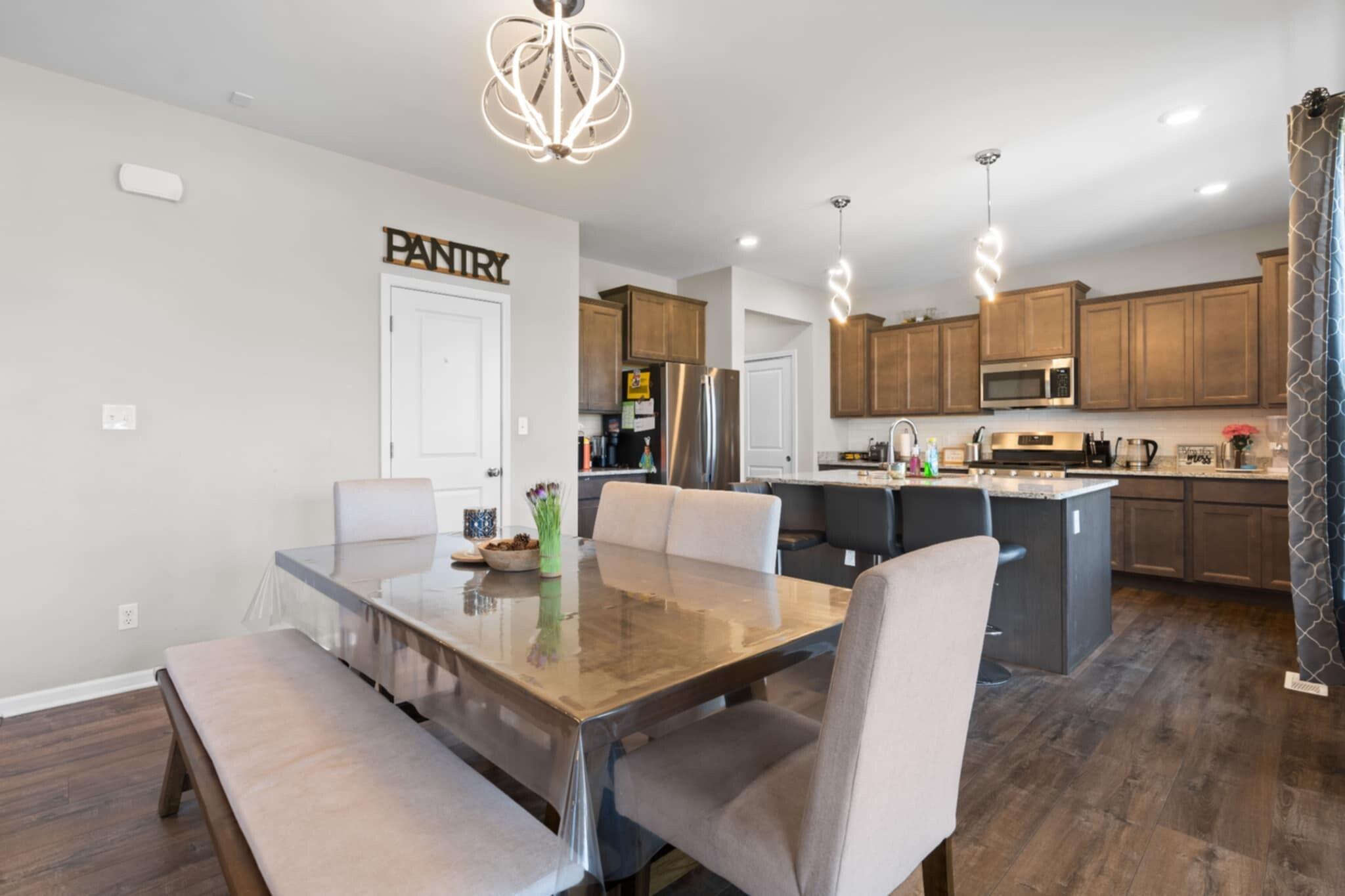 9872 Sumter Court Cedar Lake, IN 46303 - Photo 4 of 18 a kitchen with a dining table chairs and refrigerator