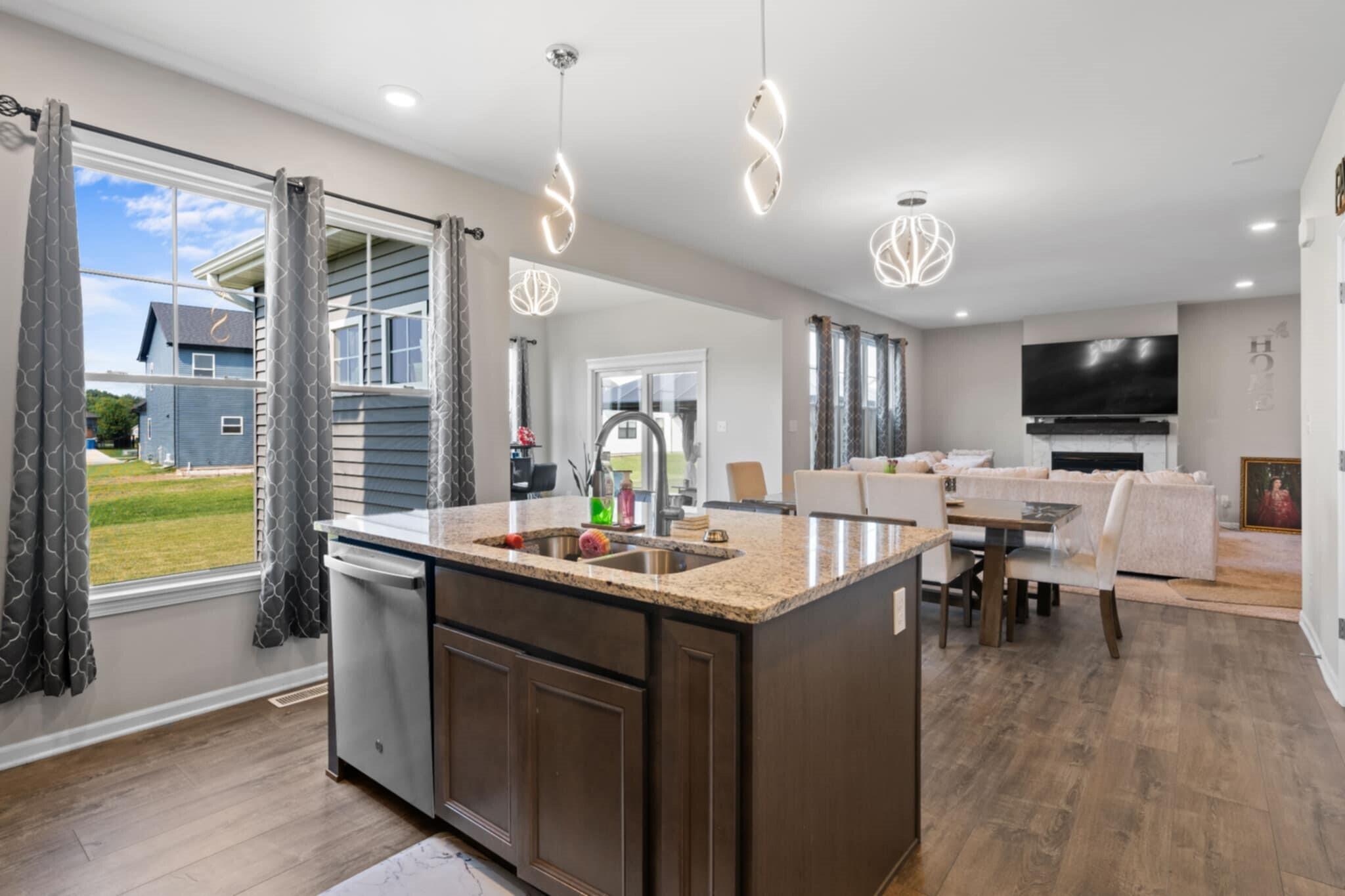 9872 Sumter Court Cedar Lake, IN 46303 - Photo 6 of 18 a dining hall with stainless steel appliances granite countertop a kitchen island a stove and a sink